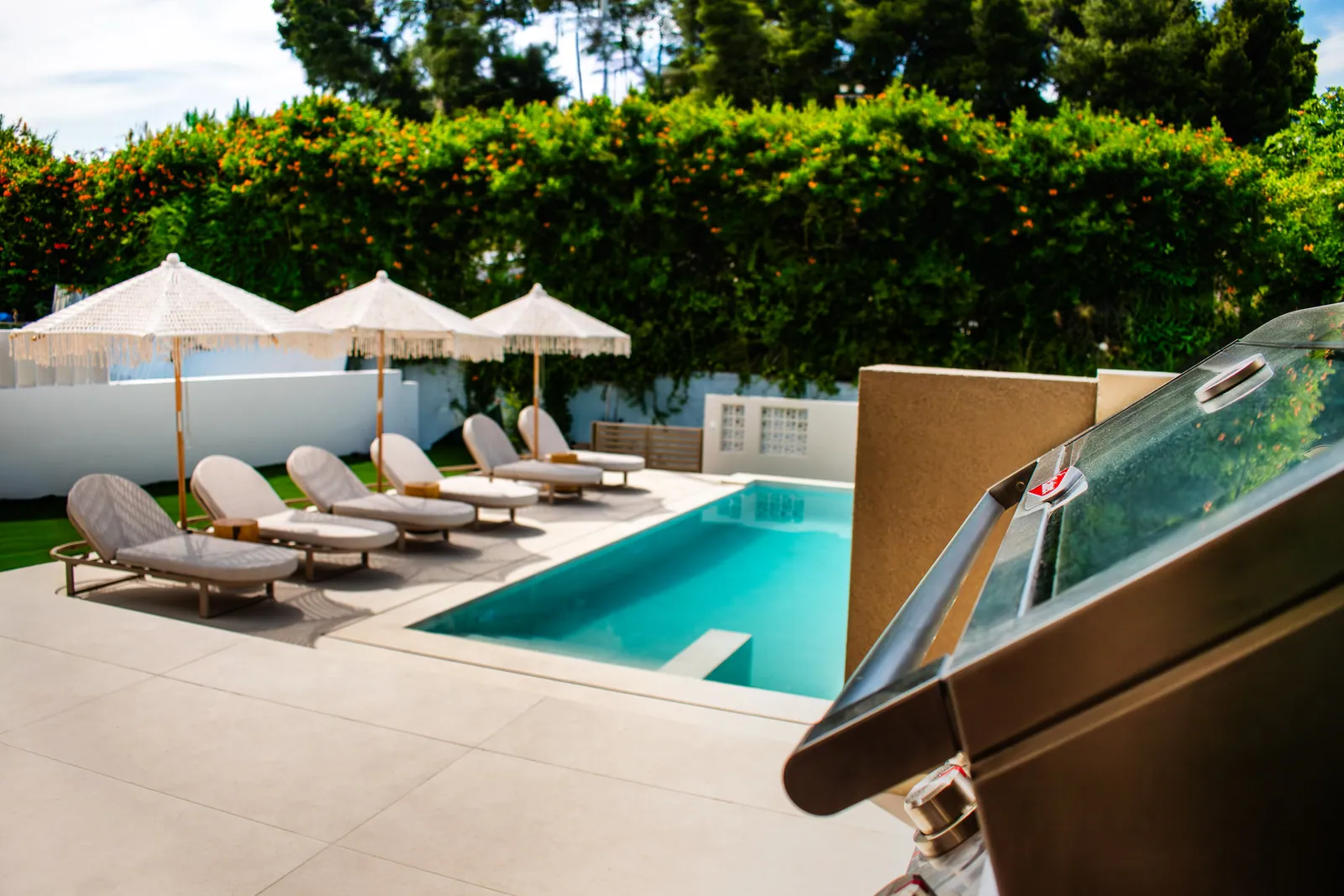 Sun loungers and umbrellas along the pool
