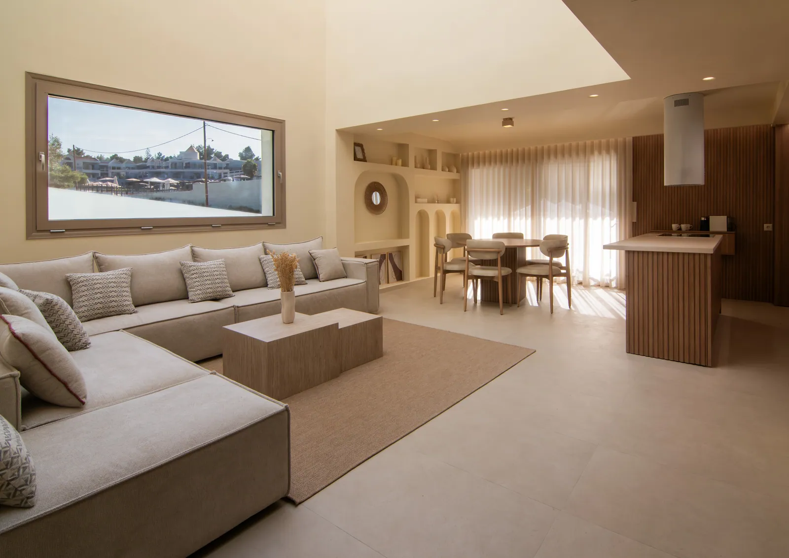 Open-plan living room in warm neutral tones