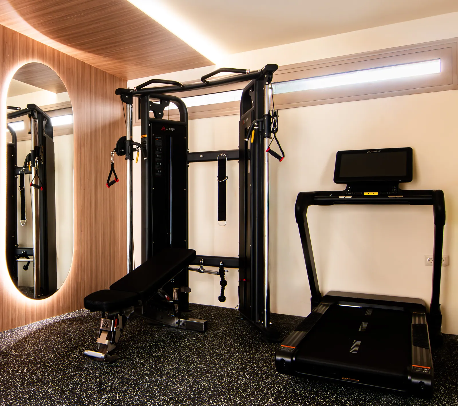Home gym with a backlit mirror