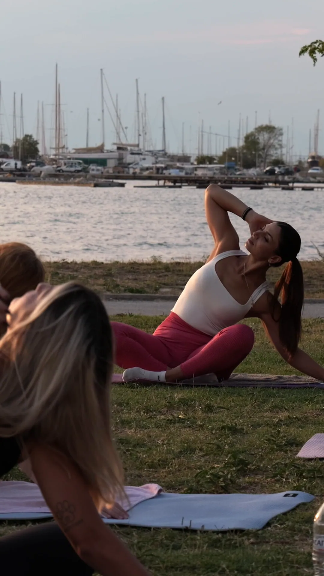Side stretch on the grass by the harbour