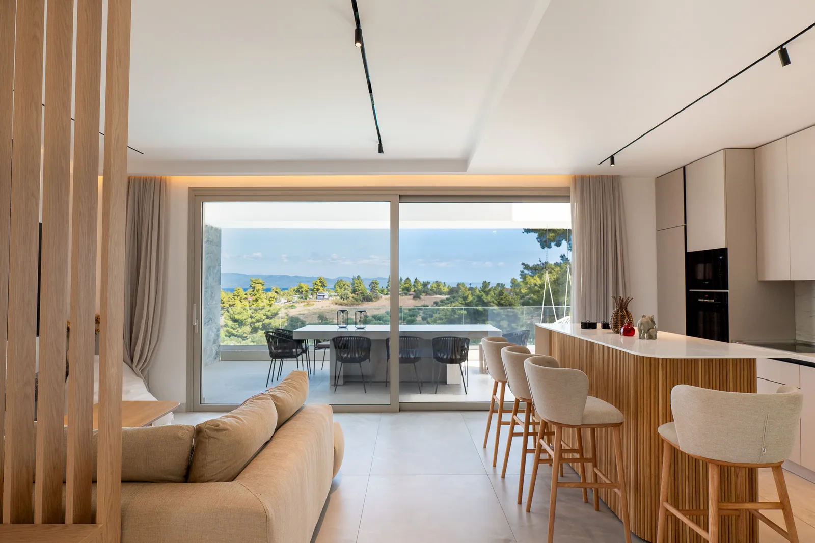 Living room opening onto the terrace and the view